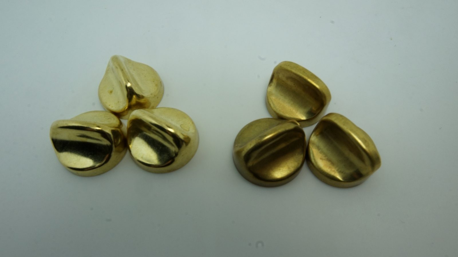 Real bathroom hardware parts before and after polishing showing brightness difference