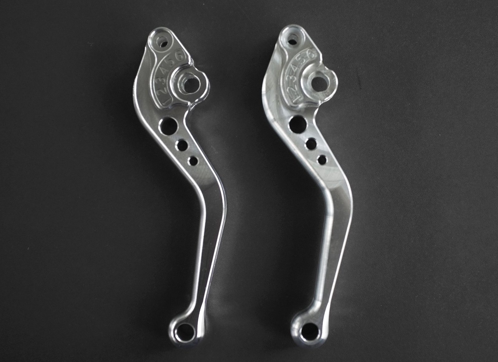 Real long aluminum motorcycle parts with holes and grooves after surface finishing